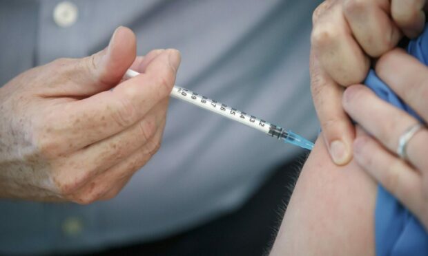 Covid vaccine being administered.