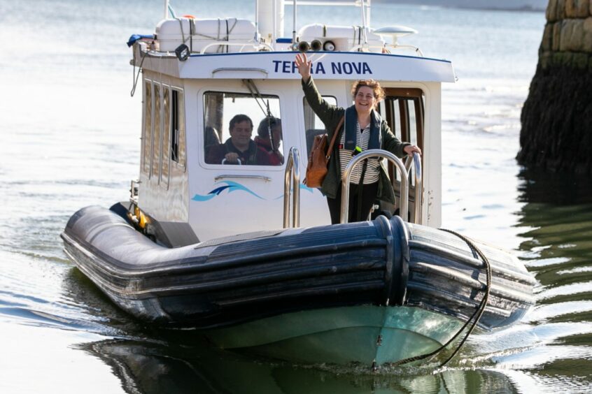 Mary Ann Kennedy arriving at the St Andrews Voices festival by boat.