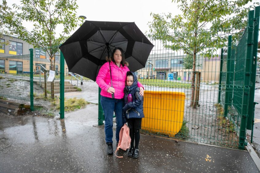 Lizzie McDaid with her other daughter, Blossom Hill, 8.