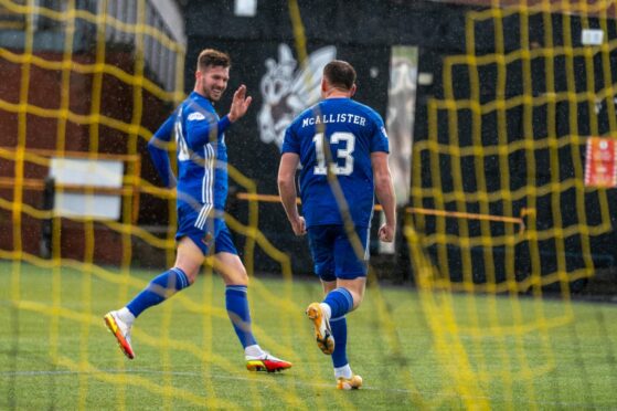 Cove Rangers substitute Jamie Masson congratulates Rory McAllister after setting up his second.