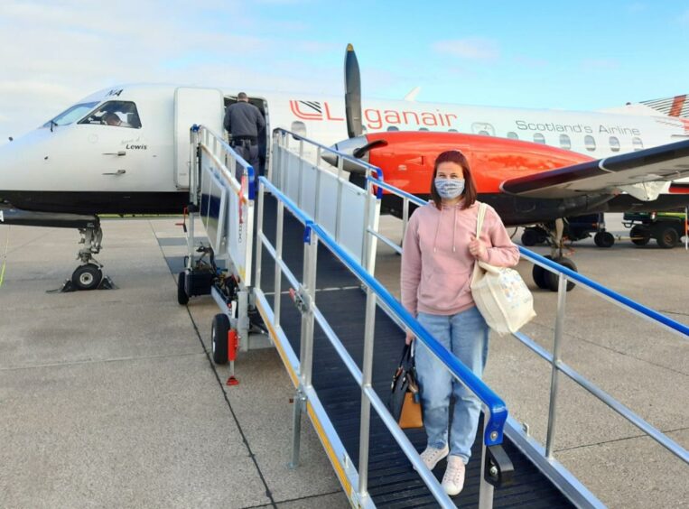 Karen Bevan boarding the flight to the national School Chef of the Year competition in Birmingham.