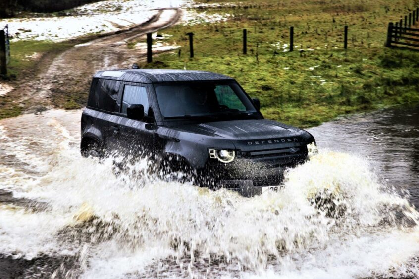 Land Rover Defender V8 off-road, going through water