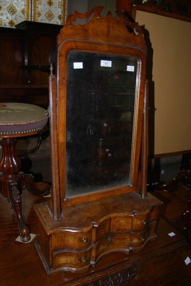 The dressing table mirror in which the emerald was found.