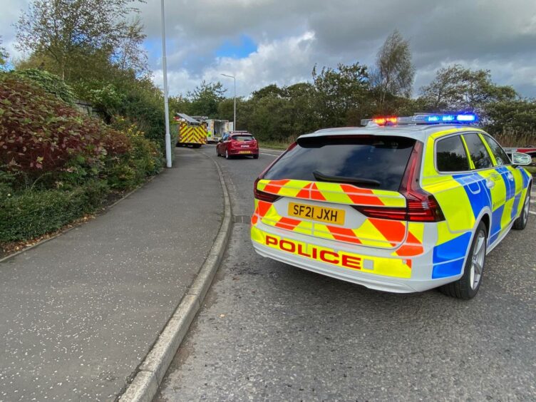 A police car blocking the B9149 in Lochgelly after a crash.