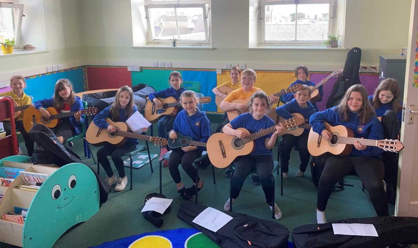 High Life Highland music students from Miller Academy in Thurso are shown with their new guitars in hand.