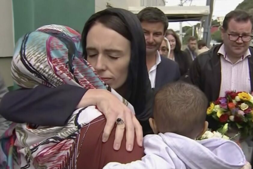 New Zealand's Prime Minister Jacinda Ardern, centre, hugs and consoles a woman as she visited Kilbirnie Mosque to lay flowers among tributes to Christchurch attack victims in March 17, 2019.