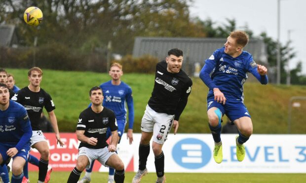 Peterhead midfielder Hamish Ritchie hits the bar against Montrose.