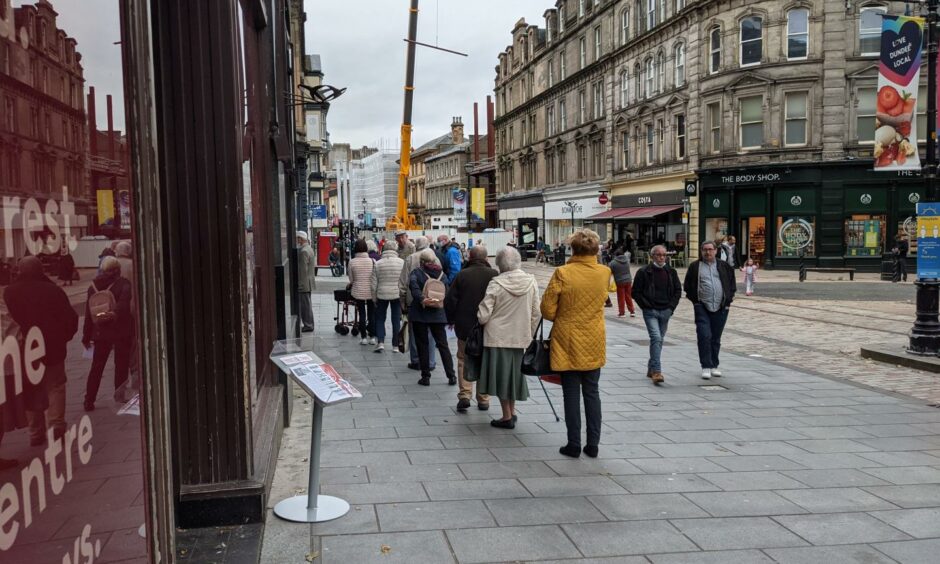 Locals queuing outside Dundee's new vaccination centre in the old Zara building.