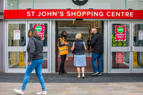Entrance to St John's Shopping Centre in Perth with people walking in