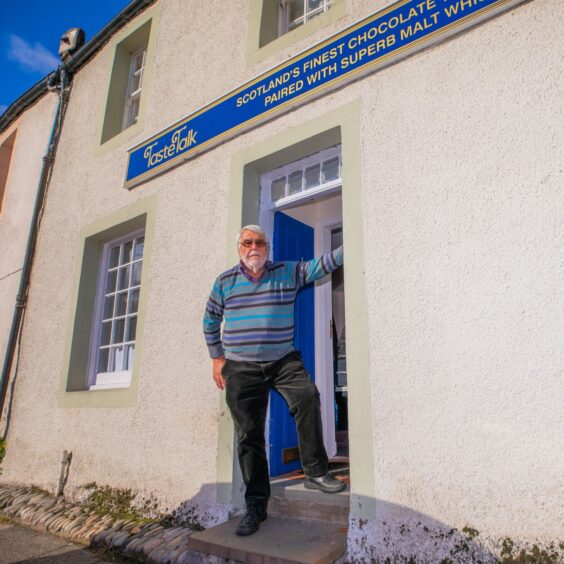 Peter outside the new premises on Dunkeld's High Street.