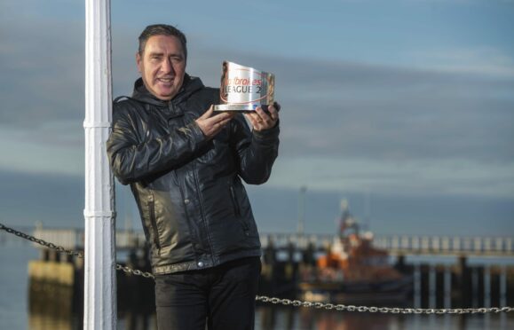 Jim McInally with his League Two manager of the month award for December 2018.