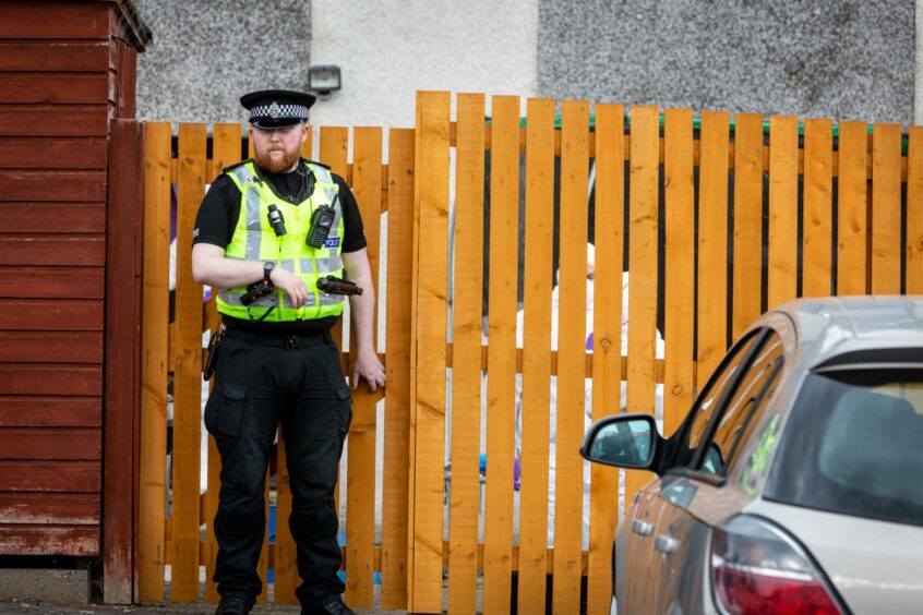 Police and Forensics officers at Colliston Avenue, Glenrothes.