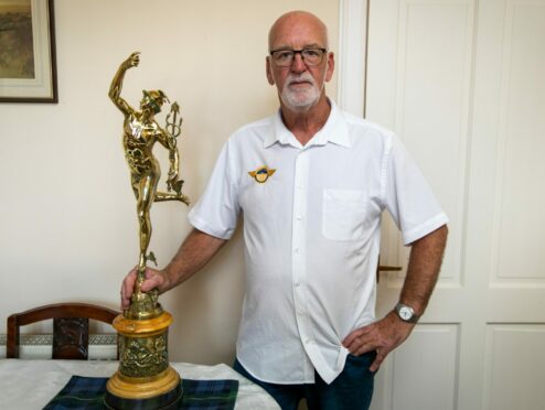 Jake Drummond with the trophy awarded to Jimmie Guthrie on his deathbed.