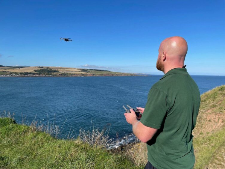 Diarmid Hawkins, lead fisheries officer with the Dee District Salmon Fishery Board testing the drone at Stonehaven.