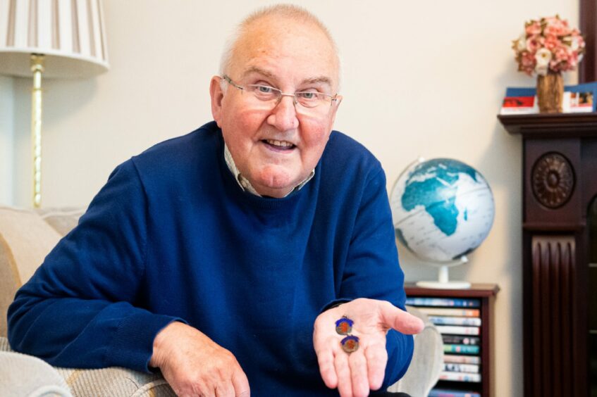 Colin Grant with two of his Scottish Qualifying Cup medals, won in his time playing with Peterhead FC.