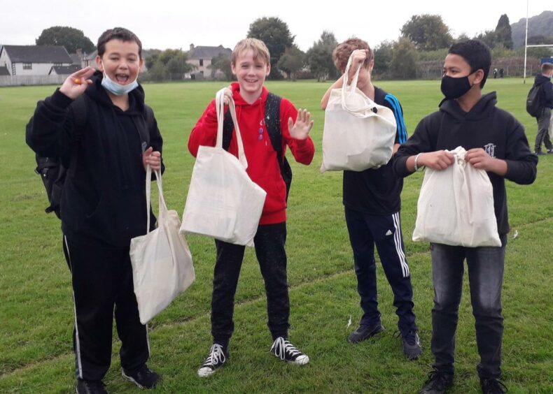 Inverness High School pupils give thanks for their wellbeing packs. 