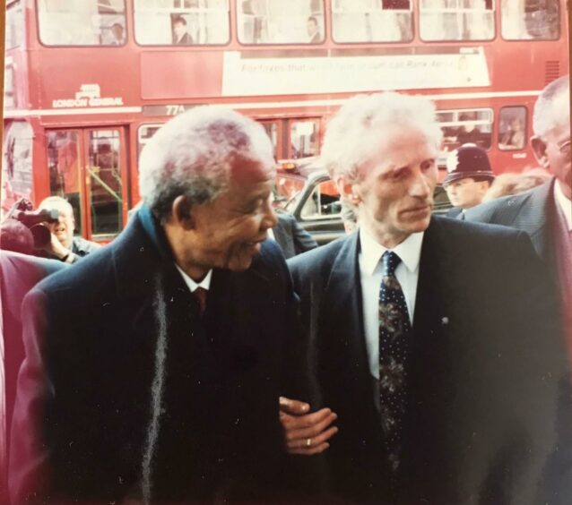 Former president of South Africa Nelson Mandela, pictured before his election with Dundee West MP Ernie Ross.