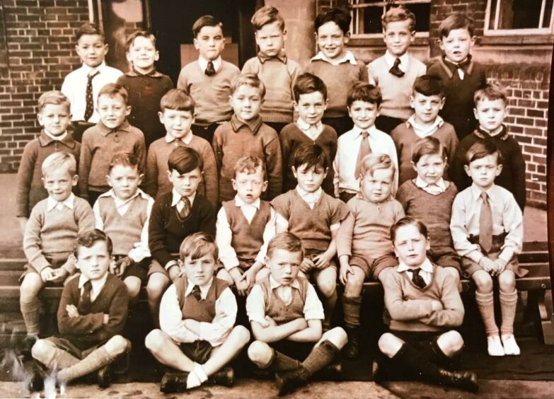 A young Ernie Ross shown bottom row, first left.