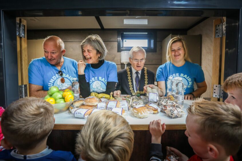 Dundee provost Ian Borthwick with Dundee Bairns volunteers.