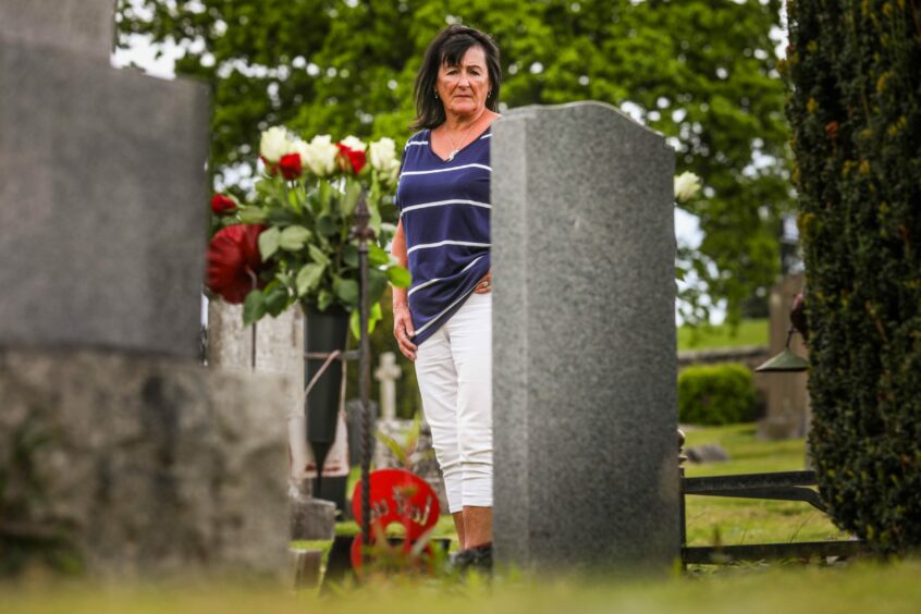Jane Duffy at her soldier son Liam Tasker's grave