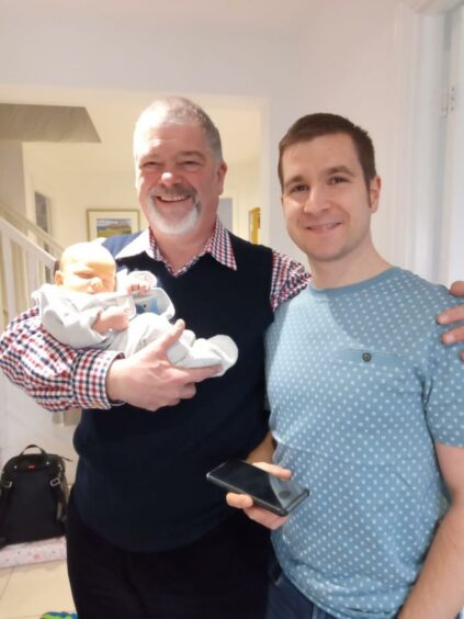 Martin Procter and doctor son, Richard, with grandson Lewis.