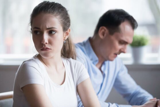 Woman looking away from man in anger