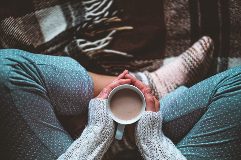 A woman with a cup of tea.