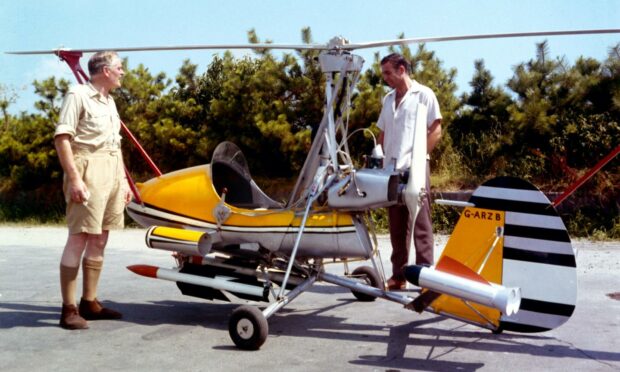 Picture from the film You Only Live Twice showing Sean Connery as James Bond by the gyroplane Little Nellie.