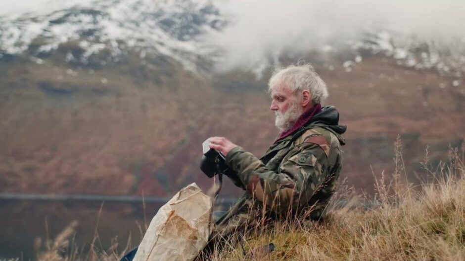 The 'Hermit of Treig' Ken Smith at Loch Treig as part of the BBC Film about him