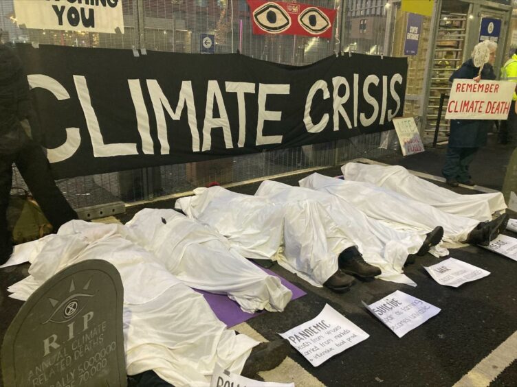 Protesters outside the entrance to COP26.
