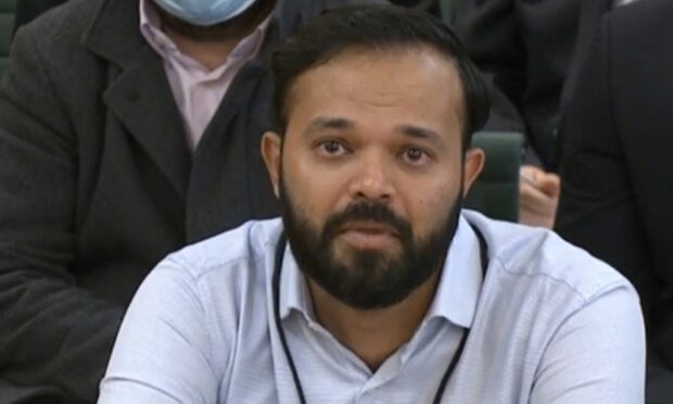Azeem Rafiq cries as he gives evidence at the inquiry into racism he suffered at Yorkshire County Cricket Club.