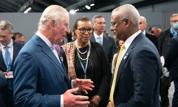 Maldives president Ibrahim Mohamed Solih, pictured taking to Prince Charles, is in Glasgow for the climate change summit.