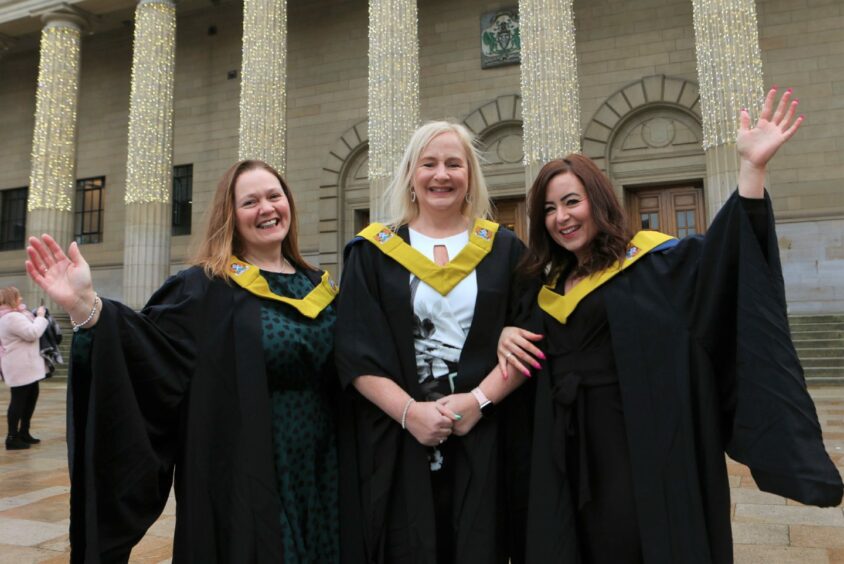 Graduates celebrating in the City Square.