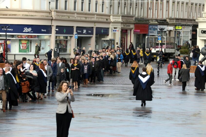 Crowds gather to enter the Caird Hall.