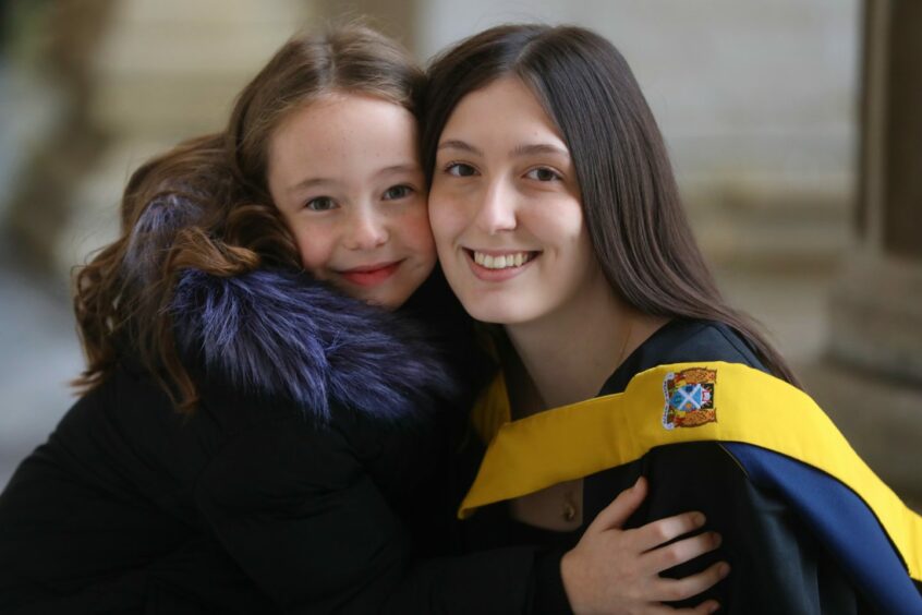 Demi Carroll, 18, with her sister Libby, 7, from Forfar. Demi is graduating from her studies in social work.