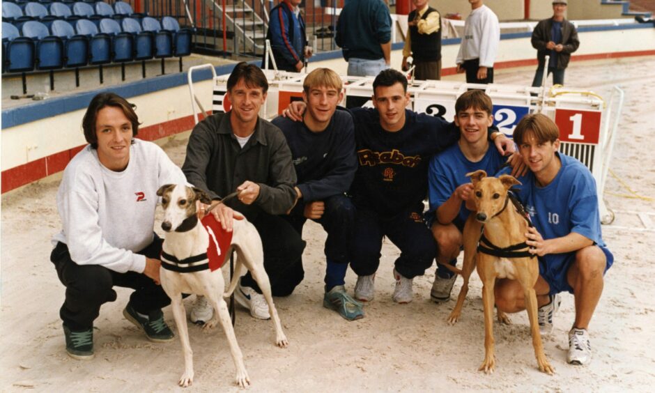 Gerry Britton, Ray Farningham, Jim Hamitton, George Shaw, Ian Anderson and Neil McCann with dogs Kilbeg Cherry and Hardies Corner at Dens Park in October 1994.