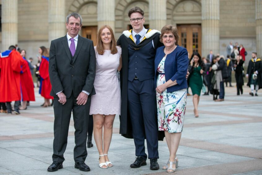 Stuart Anderson graduated with an Honours Degree in IT Management for Business. He is the first graduate apprentice with Angus Council to achieve his degree. He's pictured with George Anderson, Amy Millar and Fiona Anderson.