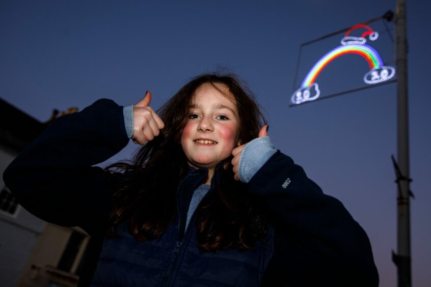 11 year old Lois Murray with her winning rainbow design.