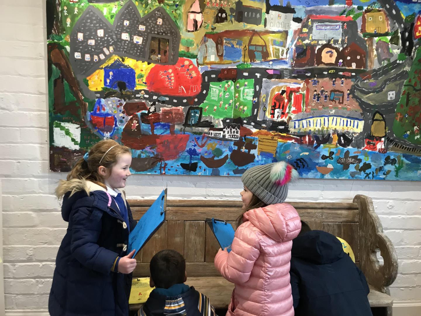 Kaleidoscope community art exhibit: Kyle Primary School pupils stand with their creation 'Our Kyle,' a colourful acrylic painting of their vision of their hometown.