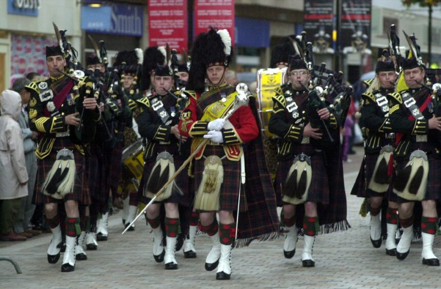 James Clark leads army procession through Inverness.