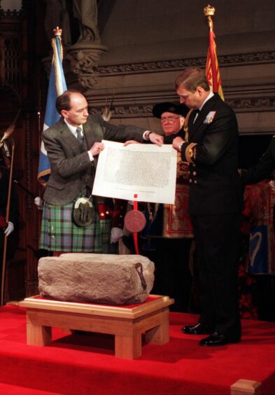 The Duke of York handing over the Stone of Destiny to Michael Forsyth in 1996.