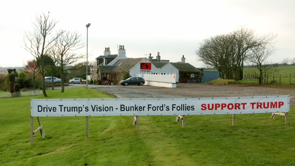 A banner that reads ' Drive Trump's vision - Bunker Ford's Follies Support Trump'