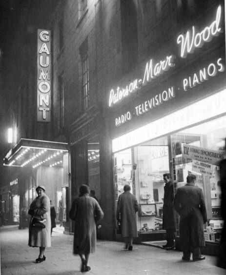 The Gaumont Cinema lit up Union Street in November 1958. It will soon be converted into flats.