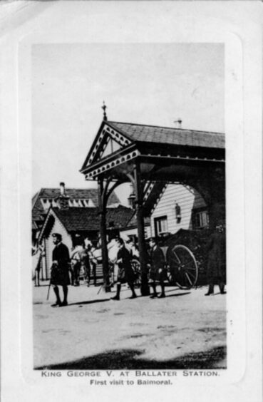 A black and white image of King George V arriving at Ballater Station