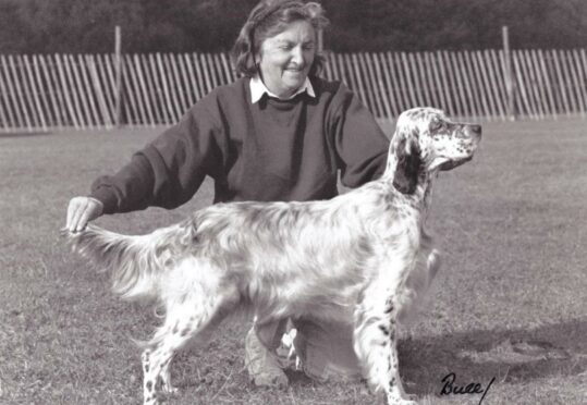 Posing with her show dog for Crufts is Maureen Kneen.