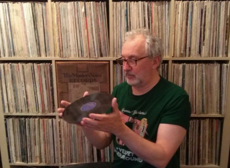 Shane Quentin with the record he discovered at the auction in Auchtermuchty.