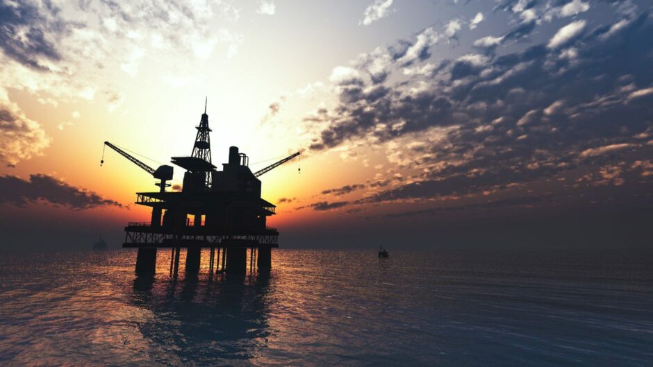 An oil rig at sunset