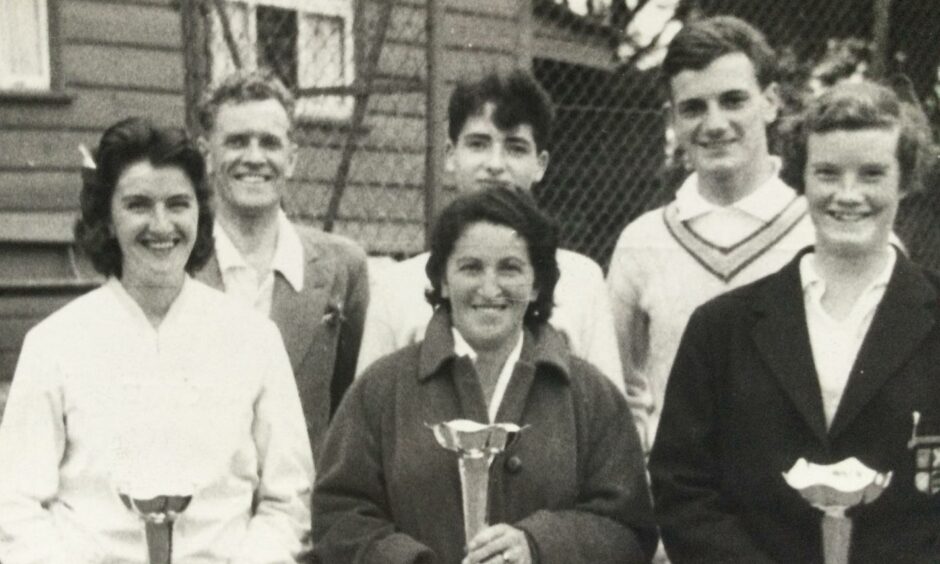David Gordon, behind Anita Ellis, centre, after winning the Henderson Vases at Stobsmuir Tennis Club, Dundee, in 1959.