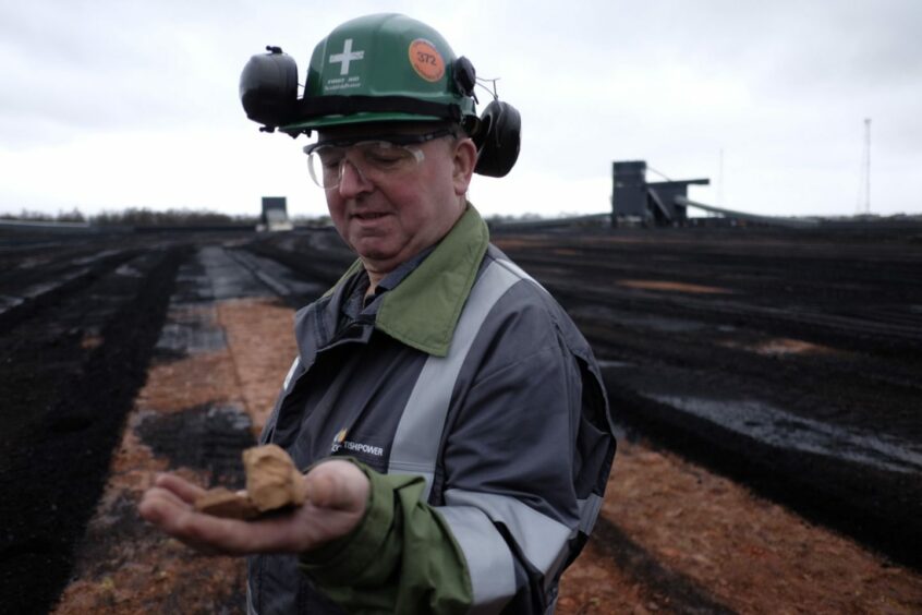 Willie Ferguson on the red carpet below Longannet's coal yard. Typically storing up to two million tonnes of coal, the red carpet at the bottom had not been seen since 1969. 