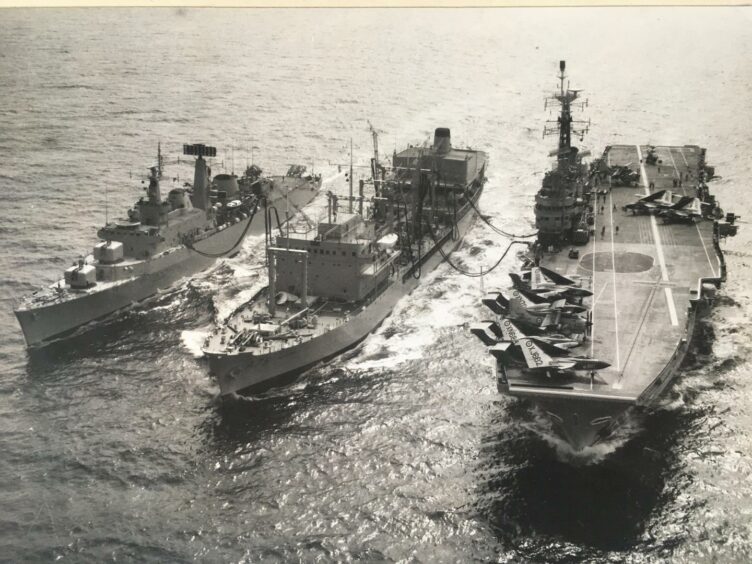 Tom joined the Royal Navy's Royal Fleet Auxiliary, pictured here refuelling two destroyers. 